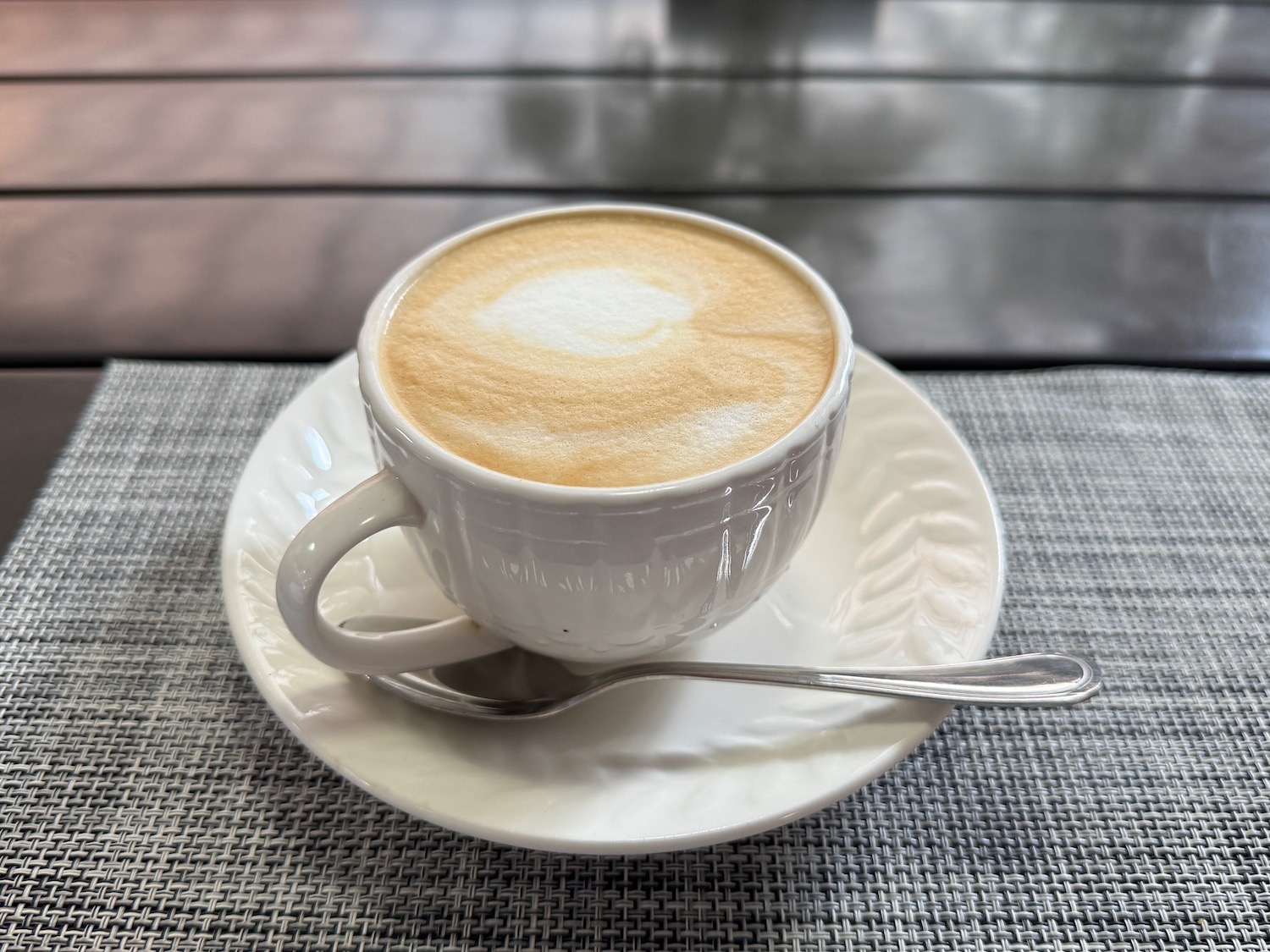 a cup of coffee with a spoon