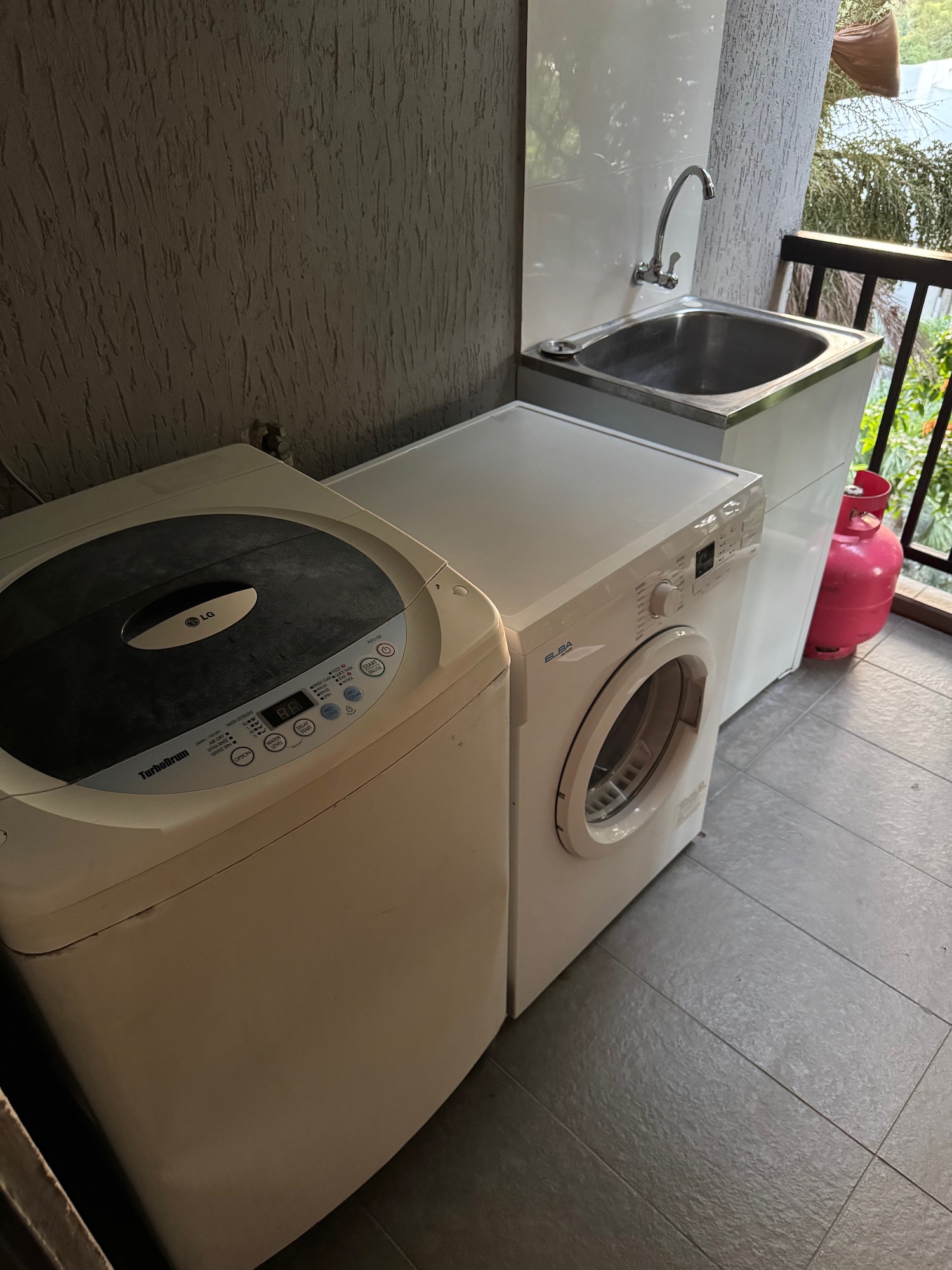 a washing machine and a washing machine on a balcony