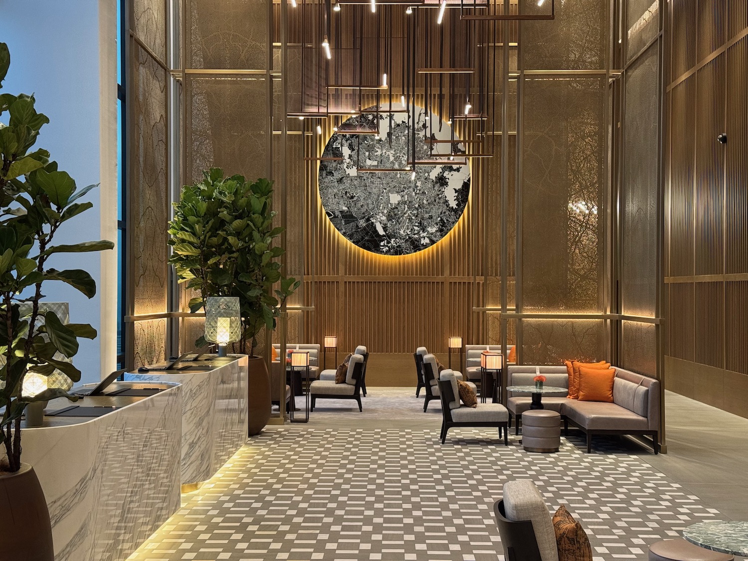 a lobby with a large round picture on the wall