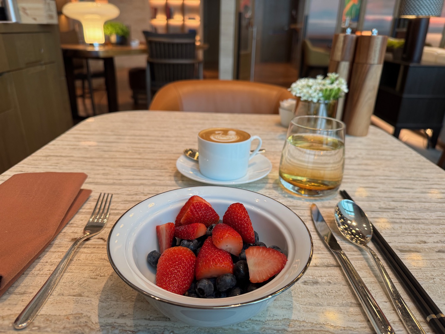 a bowl of fruit on a table
