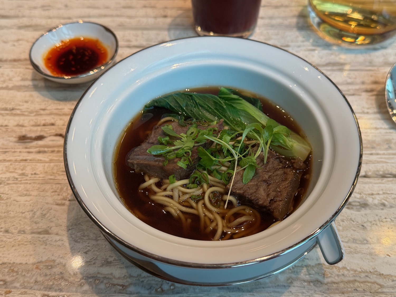 a bowl of soup with meat and vegetables