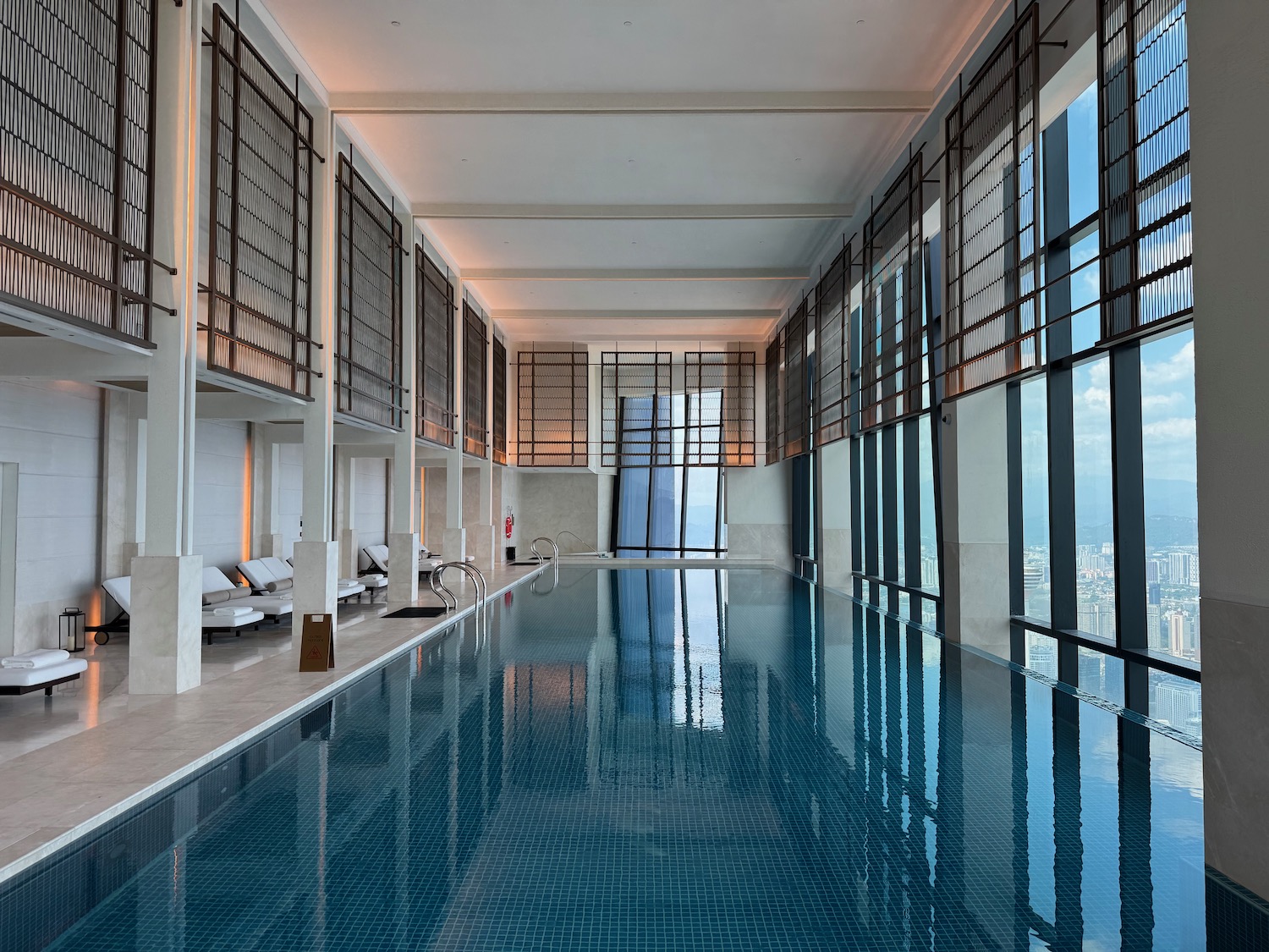 a indoor pool with a large window