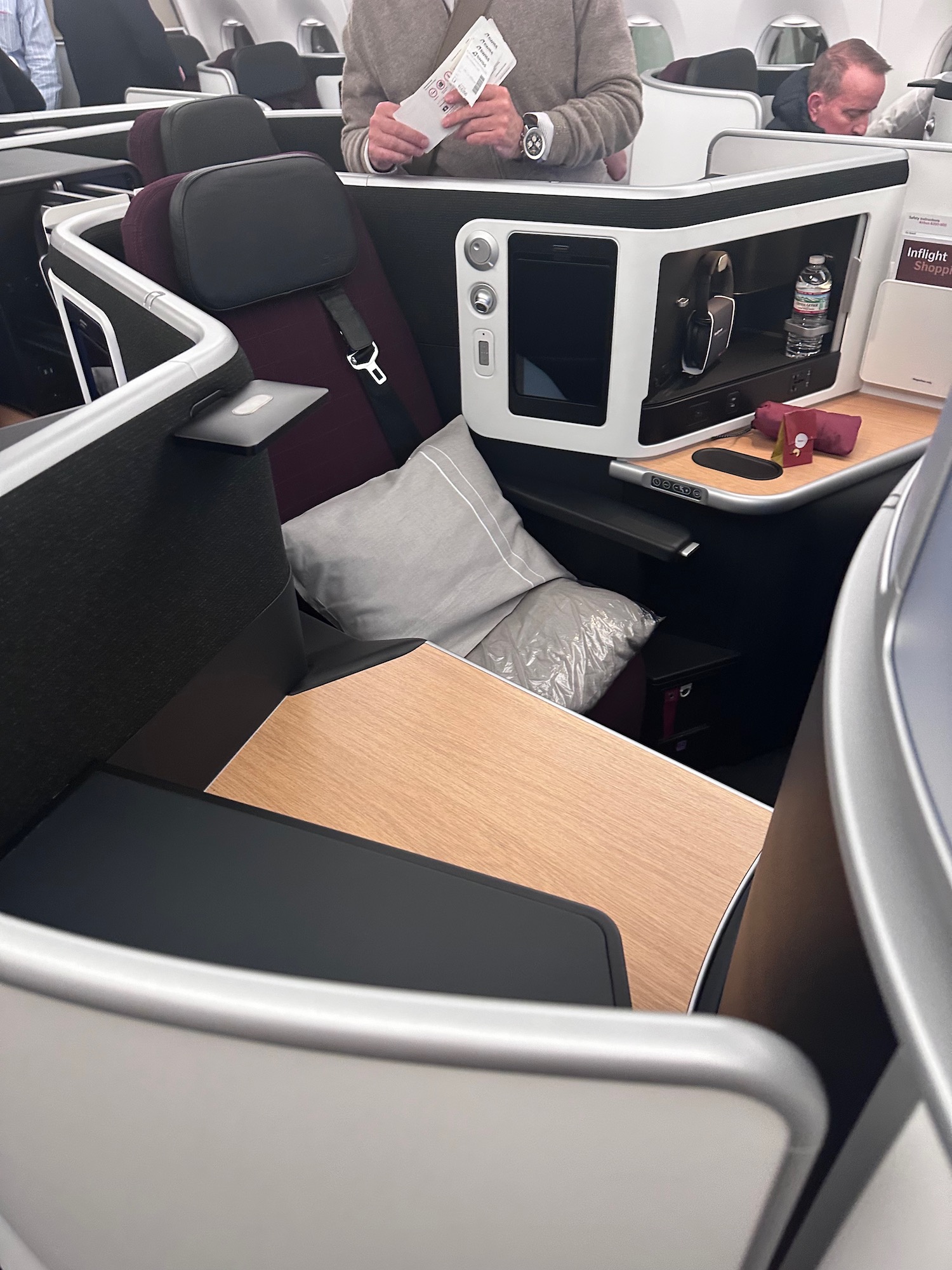 a seat and table in a business class