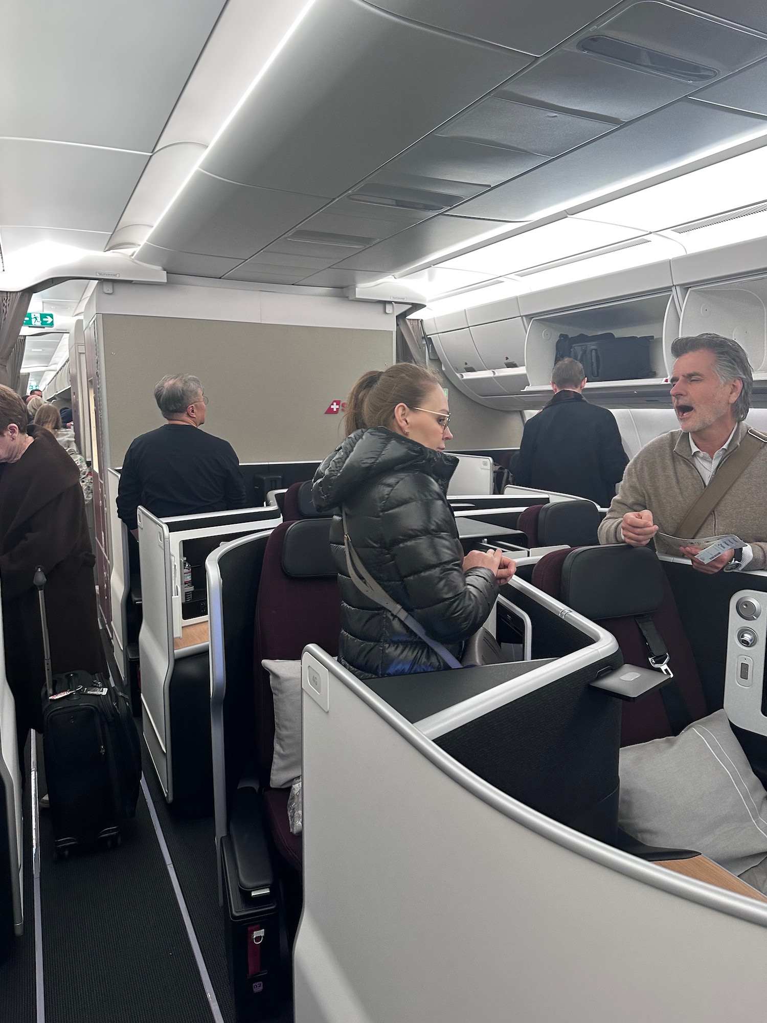 a group of people sitting in an airplane