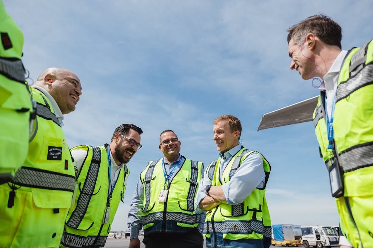 a group of men in reflective vests