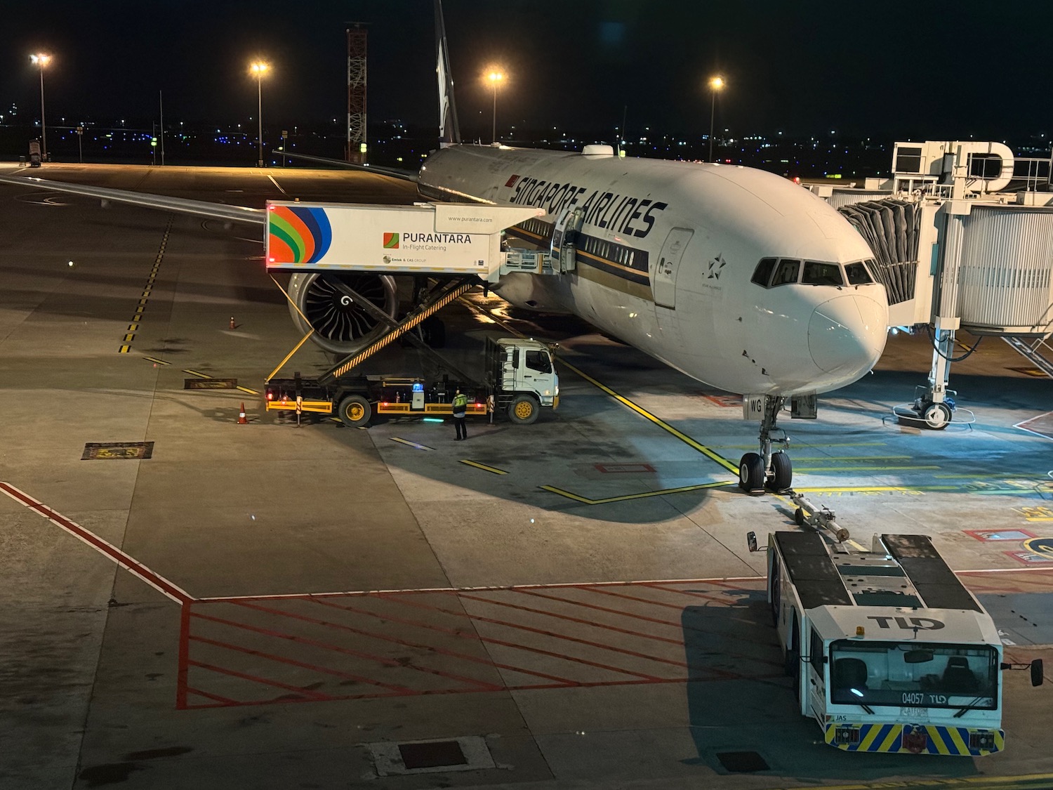 an airplane on the tarmac at night