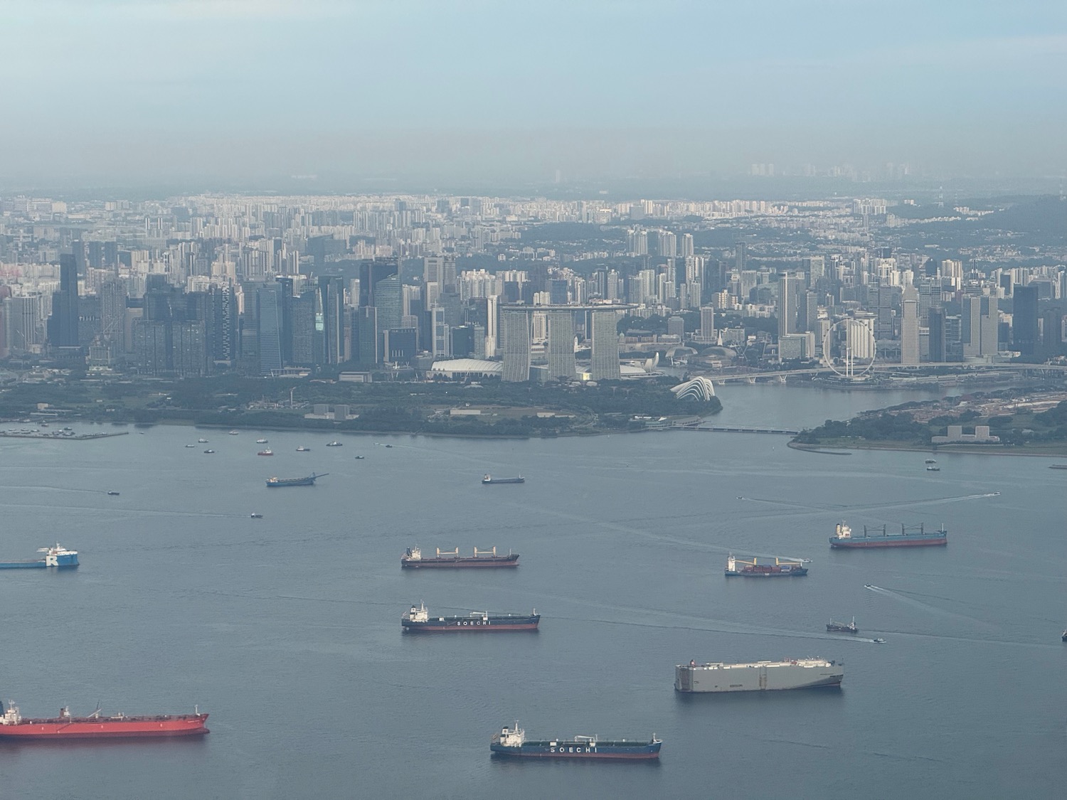 a large city with many ships in the water