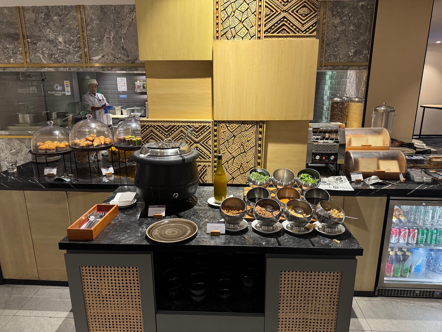 a food buffet with a variety of food in bowls