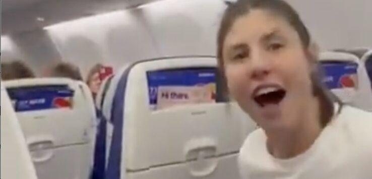 a woman sitting in an airplane