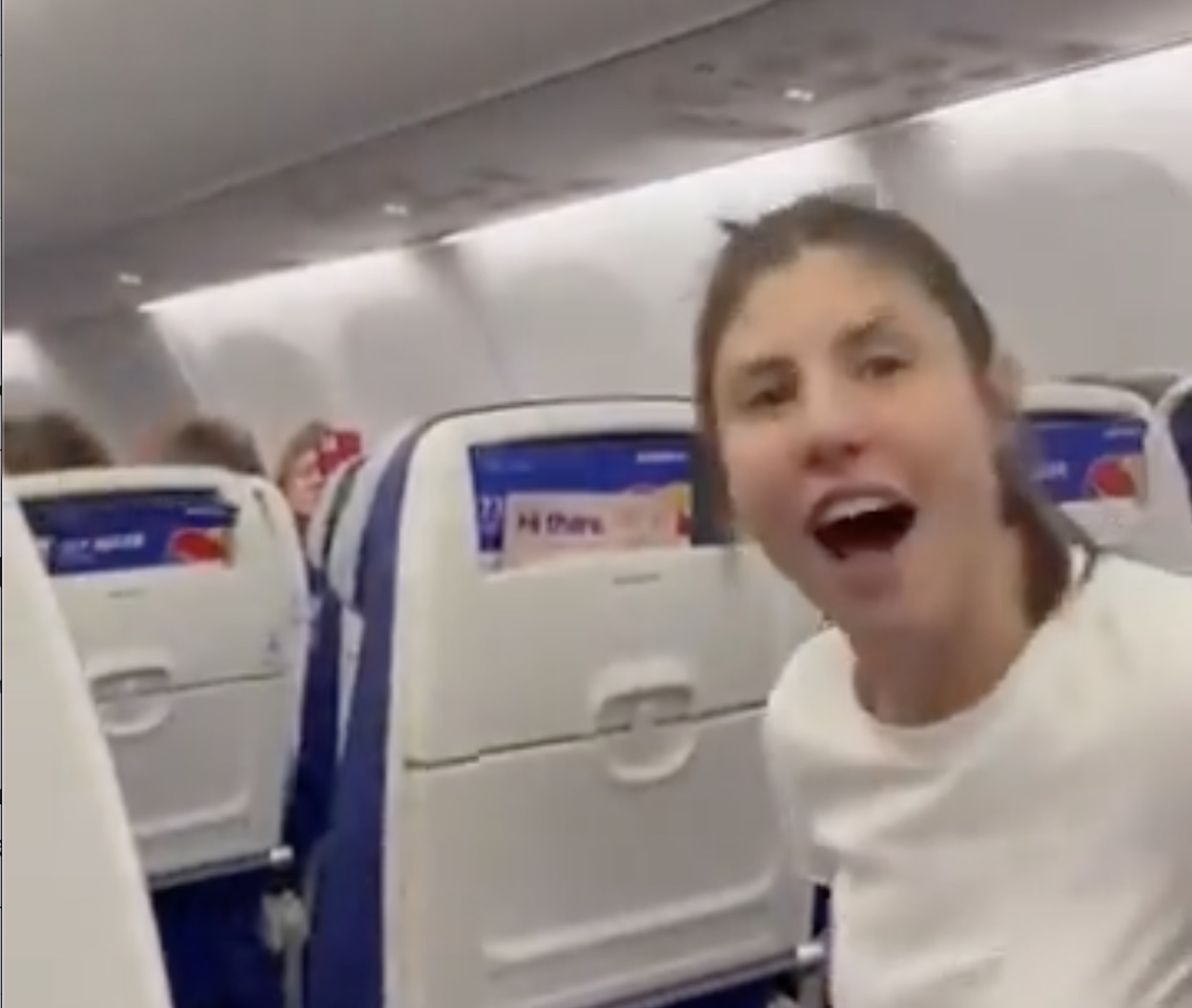 a woman sitting in an airplane