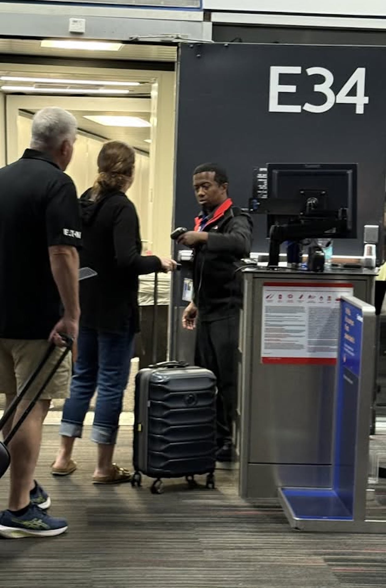 a group of people standing next to a machine
