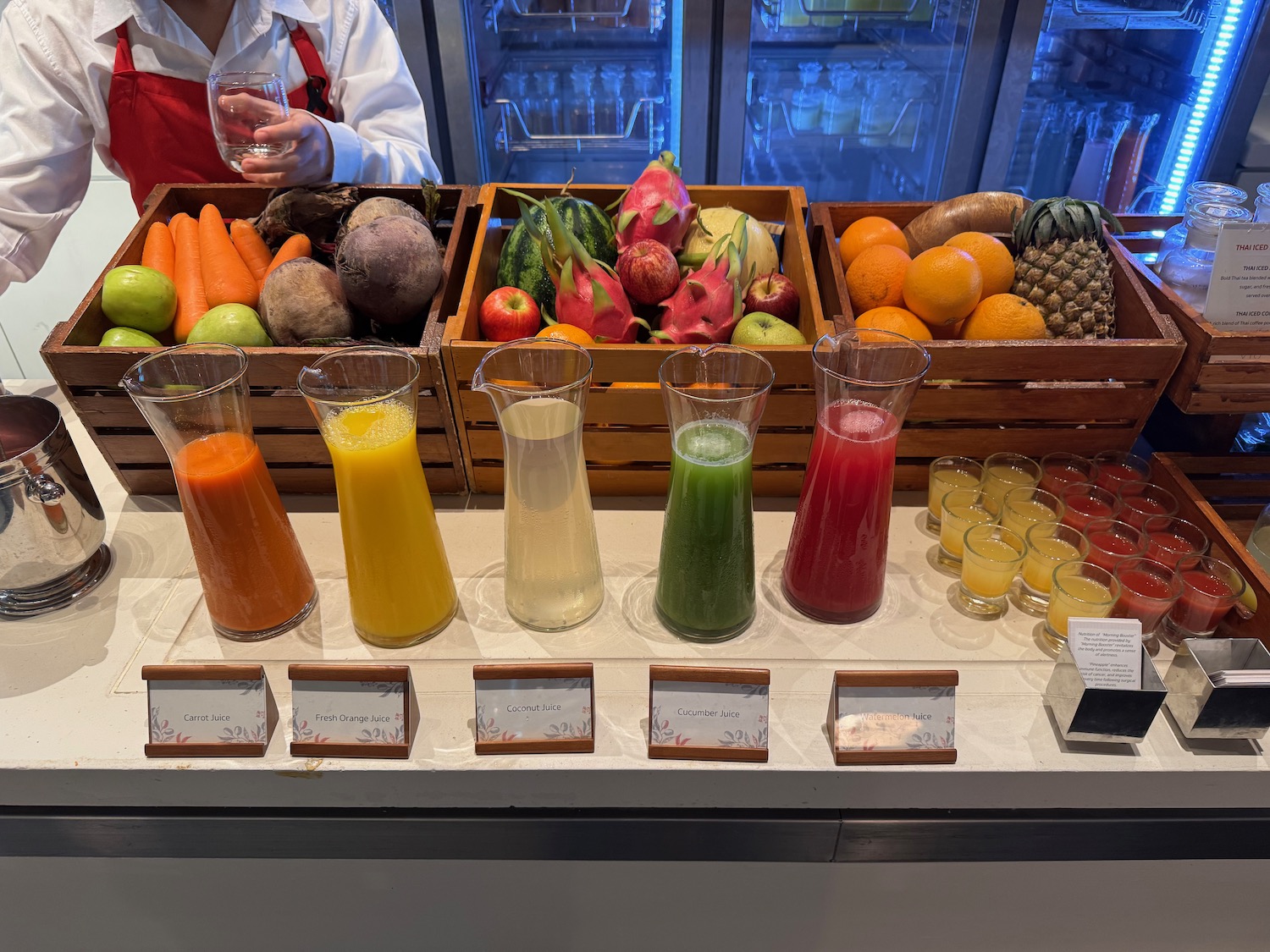a table with fruit and juices