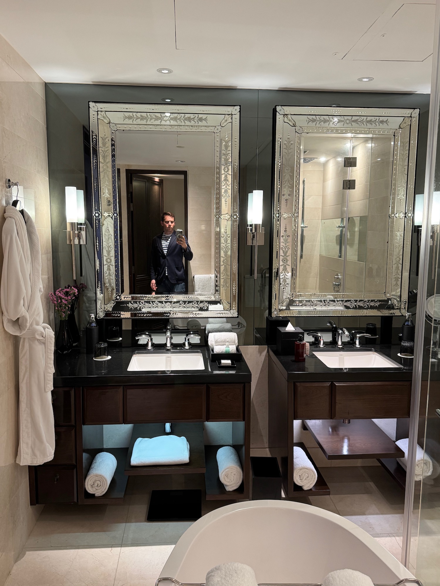 a man taking a selfie in a bathroom