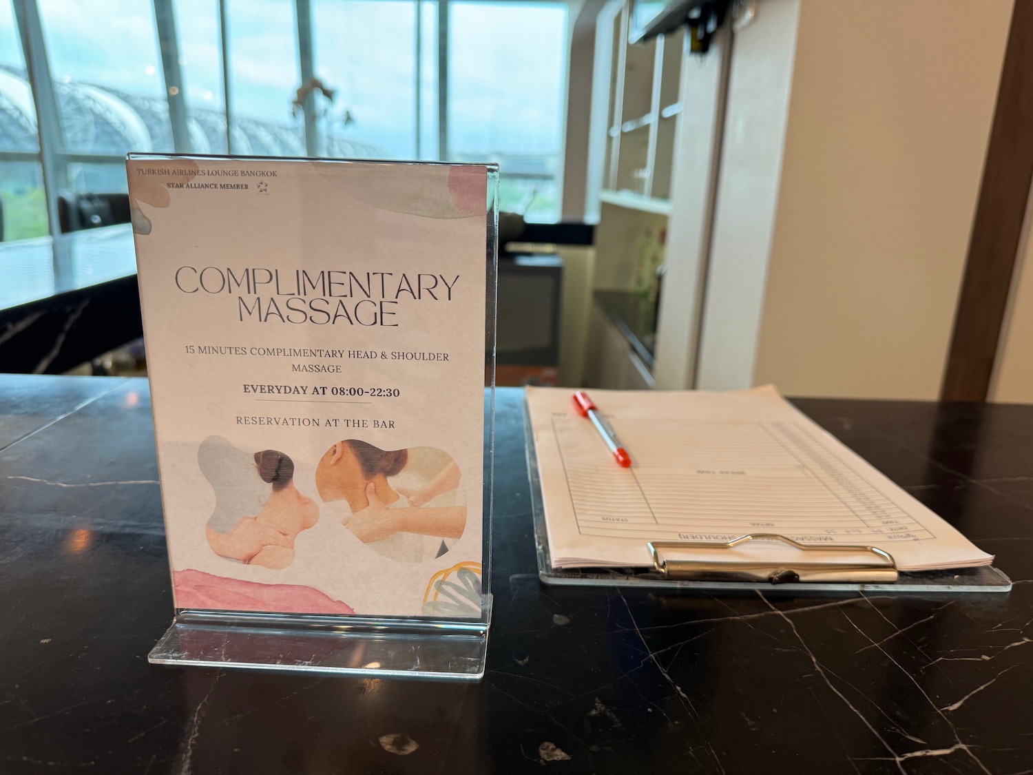 a sign next to a clipboard