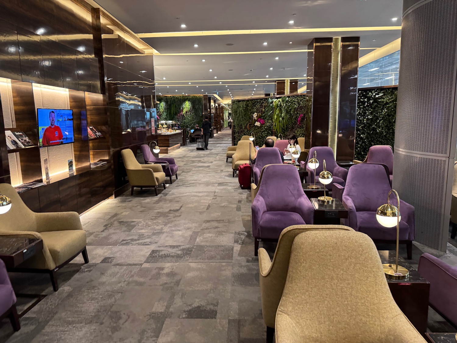 a room with purple chairs and tables