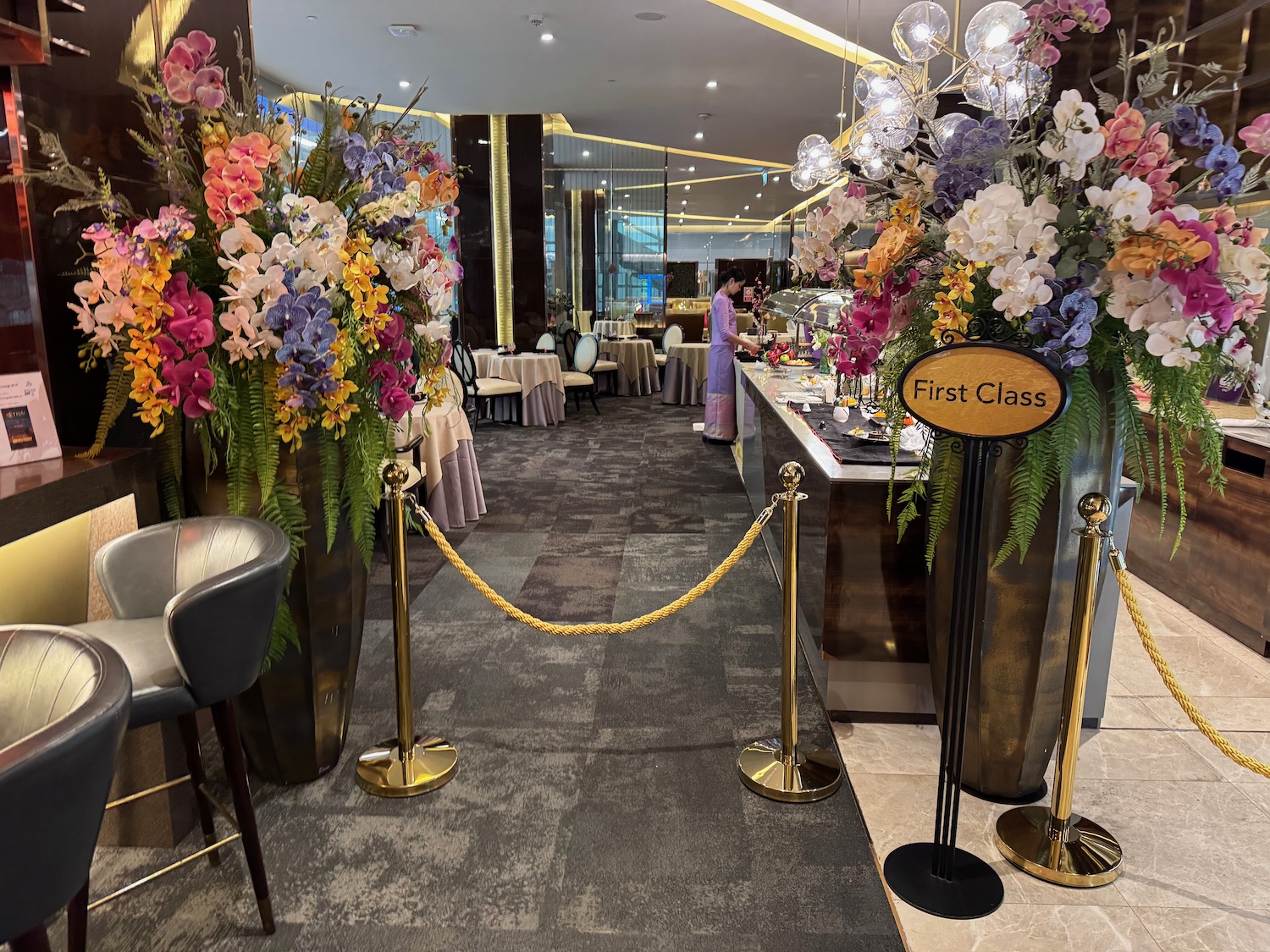 a roped gold barriers in a restaurant