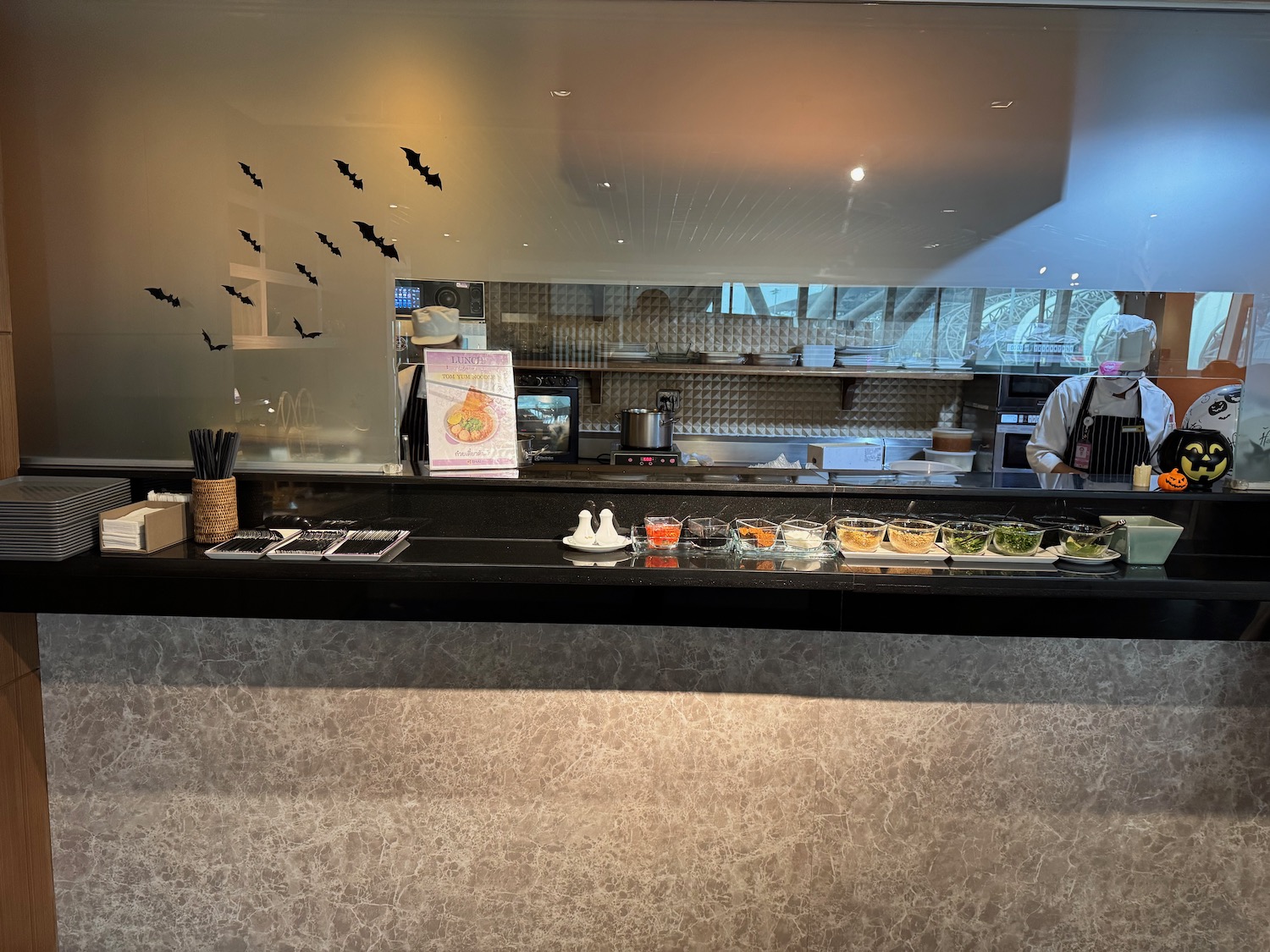 a man standing behind a counter