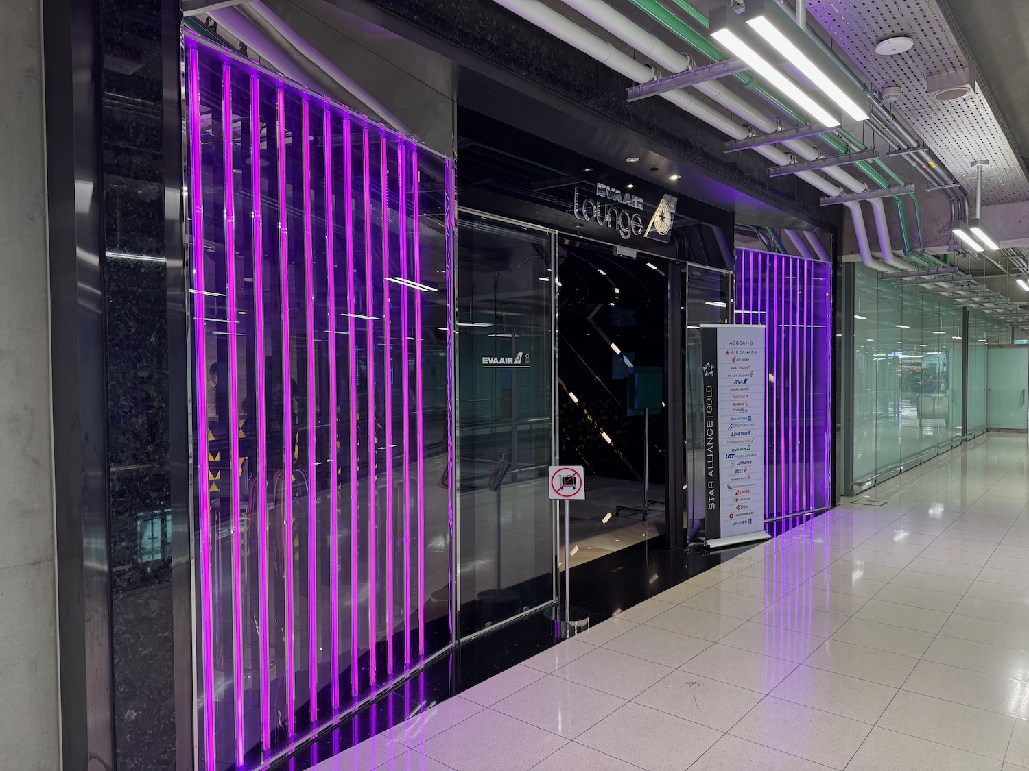 a storefront with purple lights