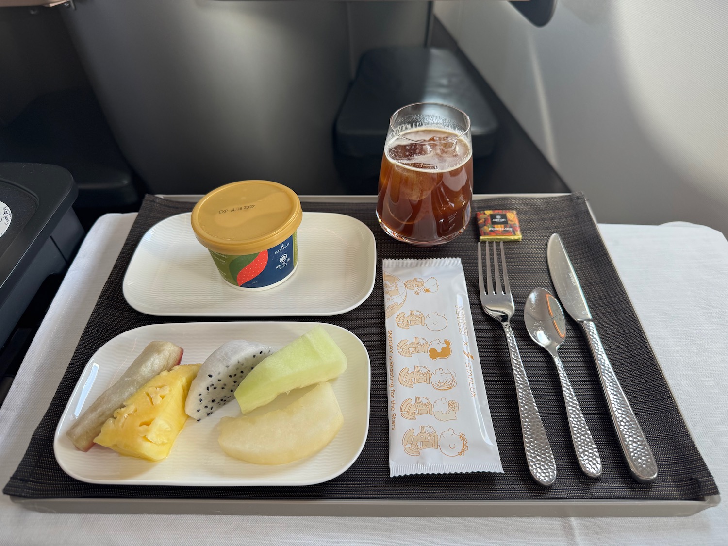 a tray with food and a drink on it