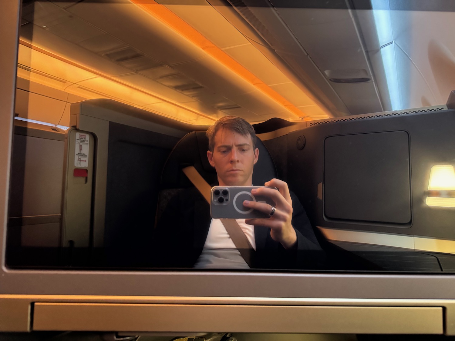 a man taking a selfie in an airplane