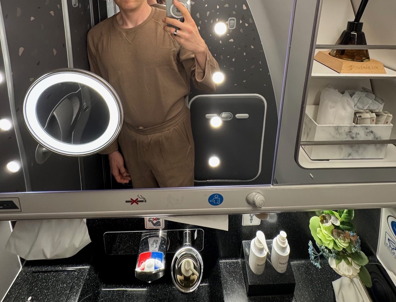 a man taking a selfie in a mirror