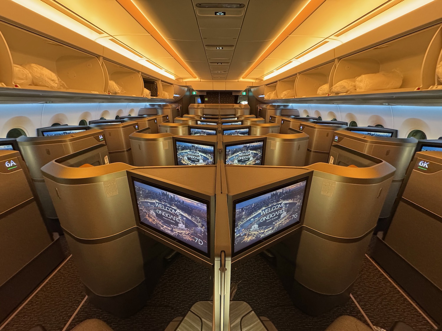 a row of monitors in an airplane