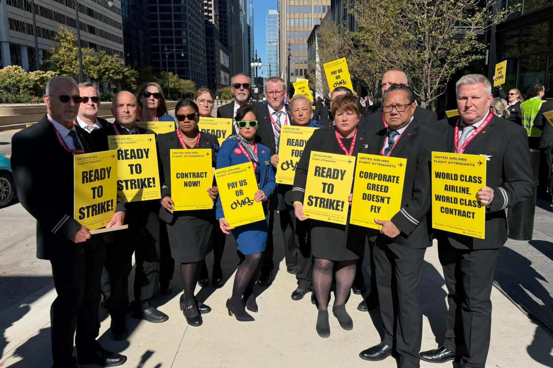 a group of people holding signs