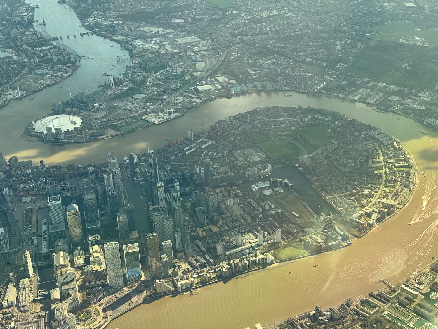 a city with a river and a city in the distance