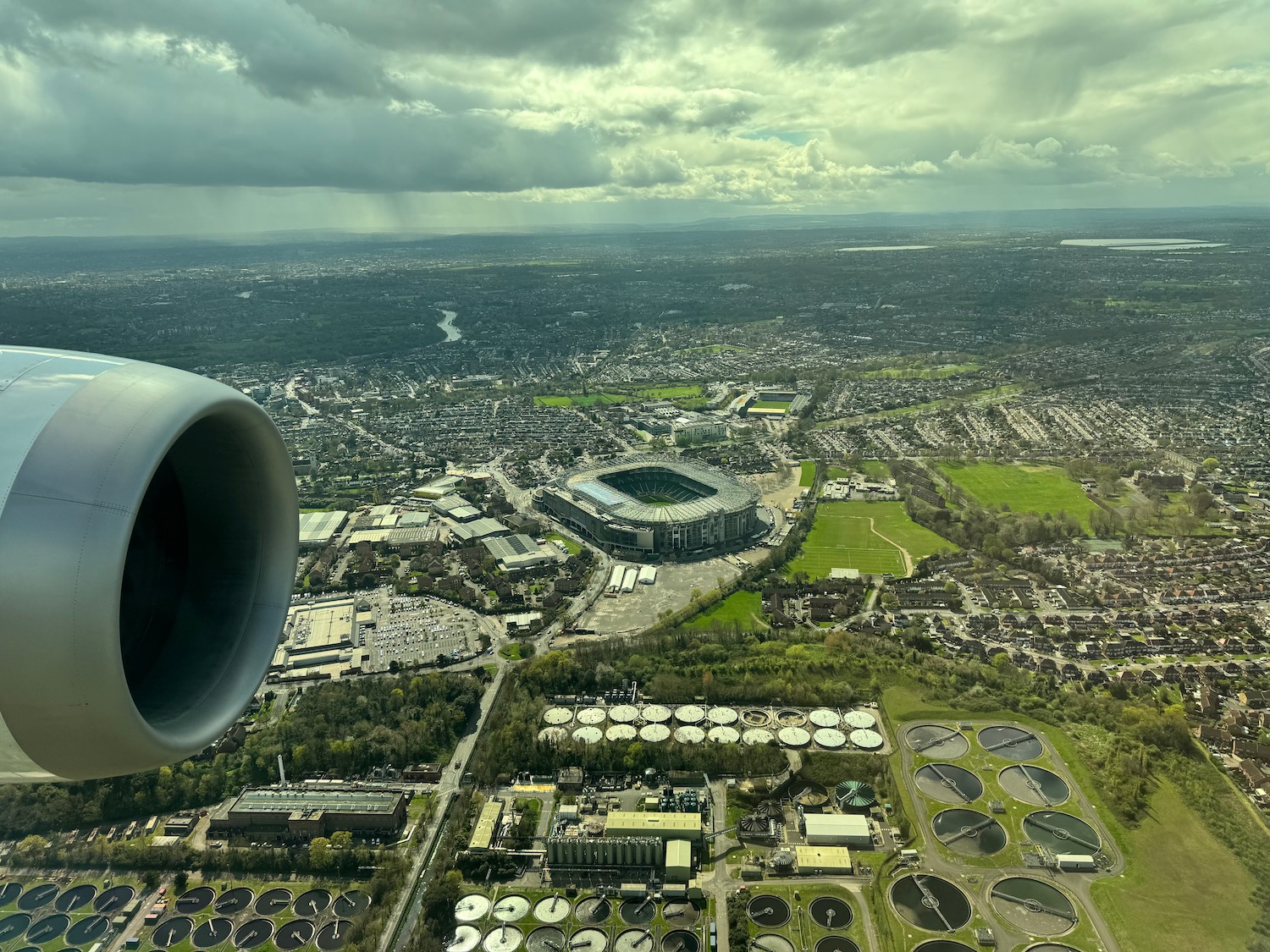 an airplane wing and a city