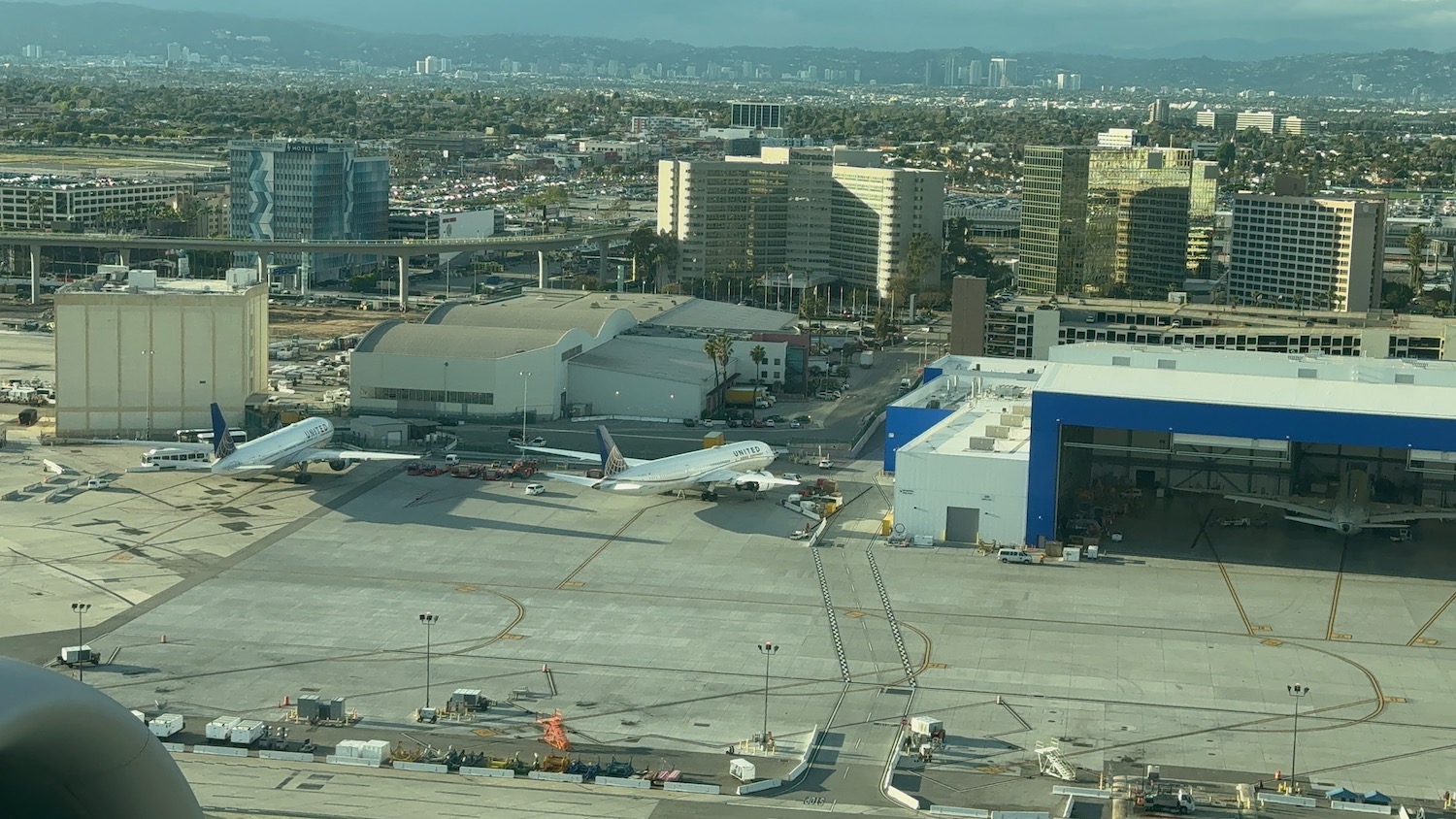 an airport with planes on the ground