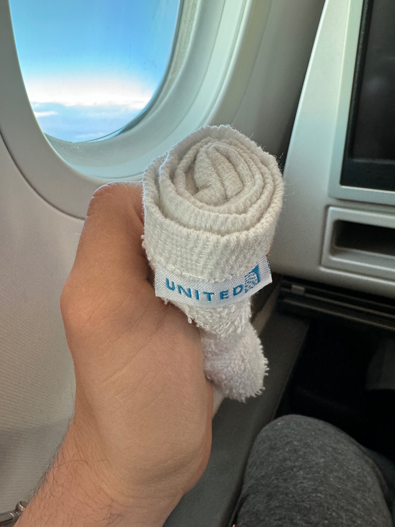 a hand holding a towel