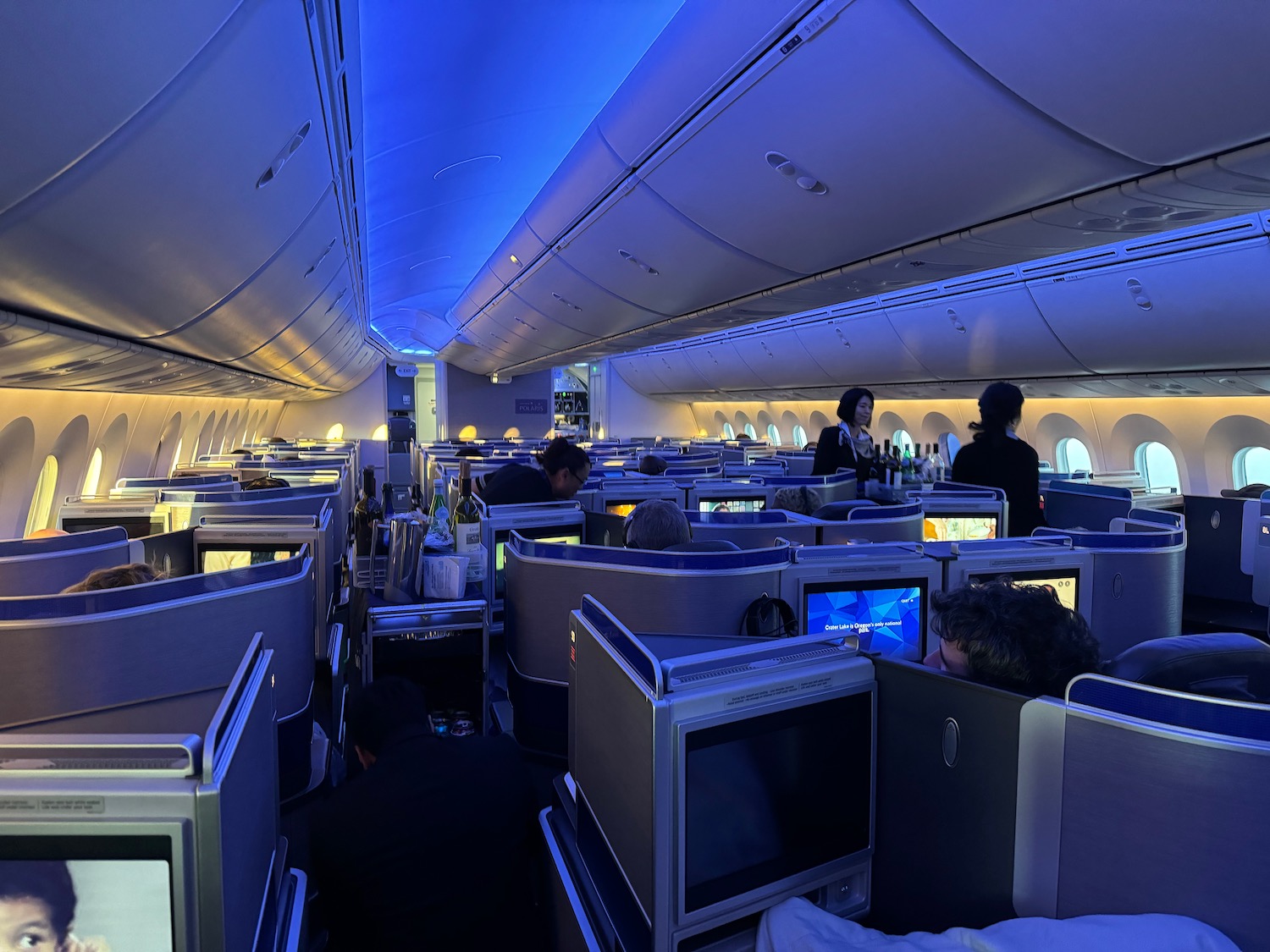 a group of people sitting in an airplane
