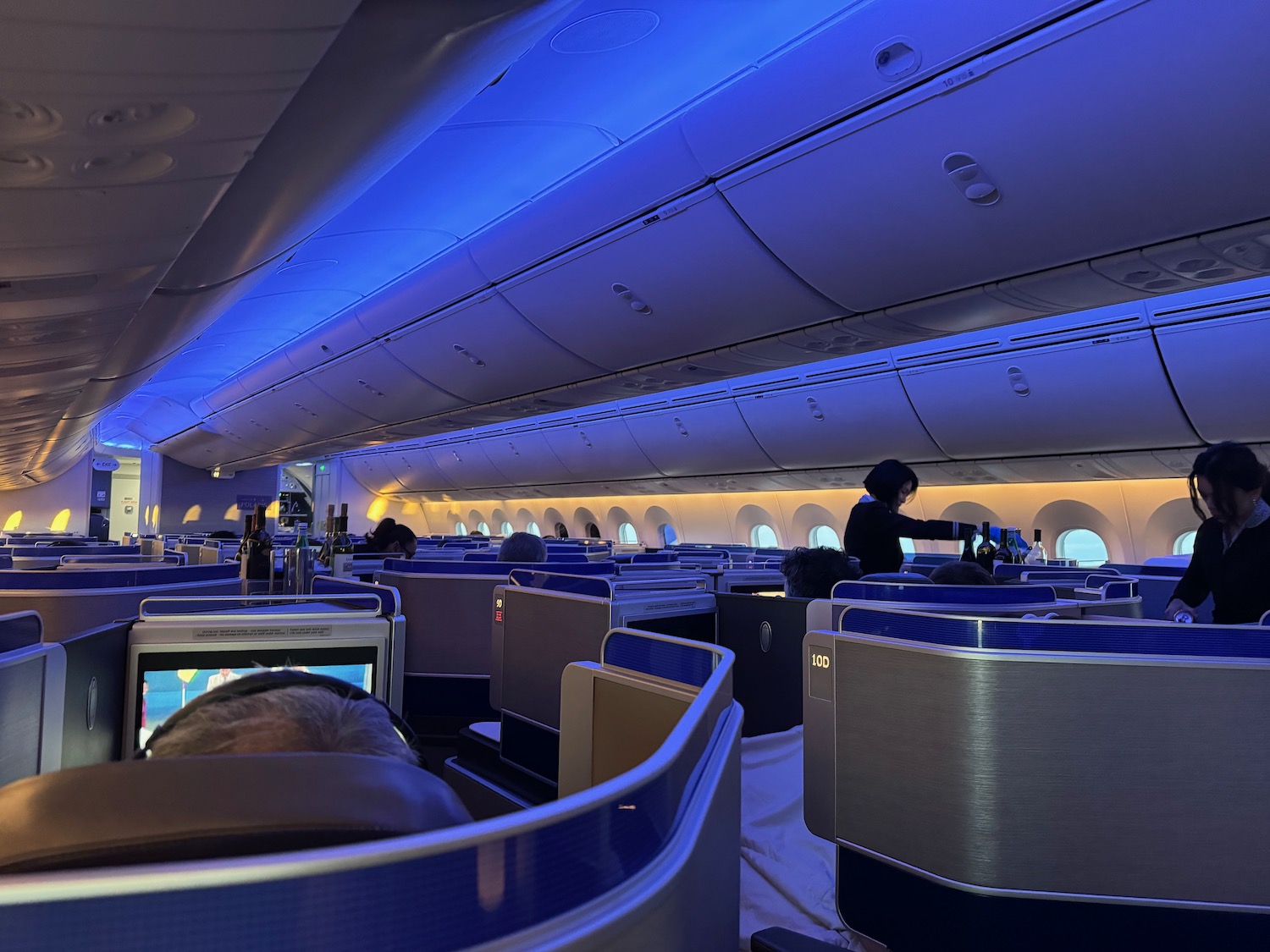 an airplane with seats and a person in the back