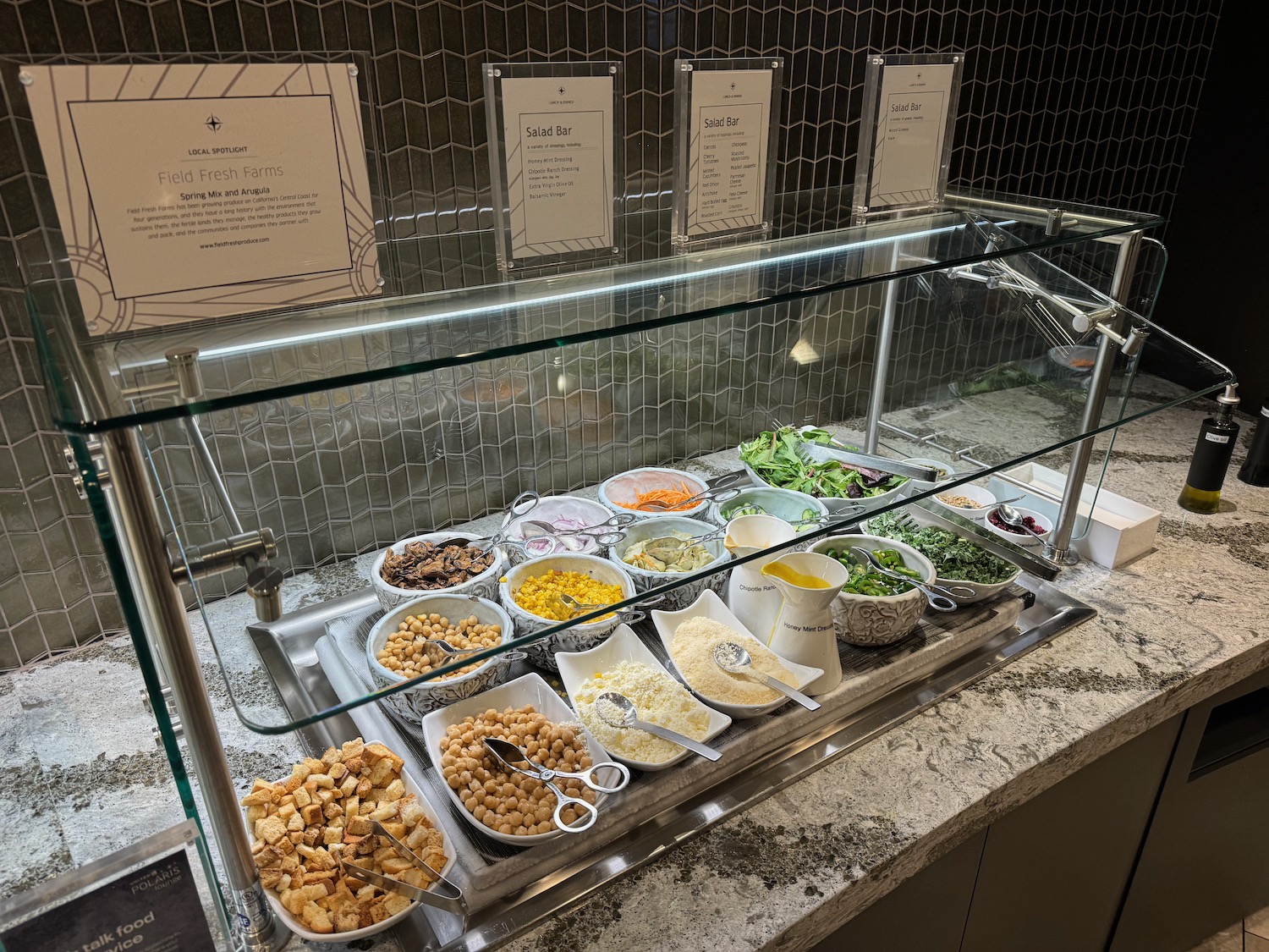 a food buffet with different types of food in bowls
