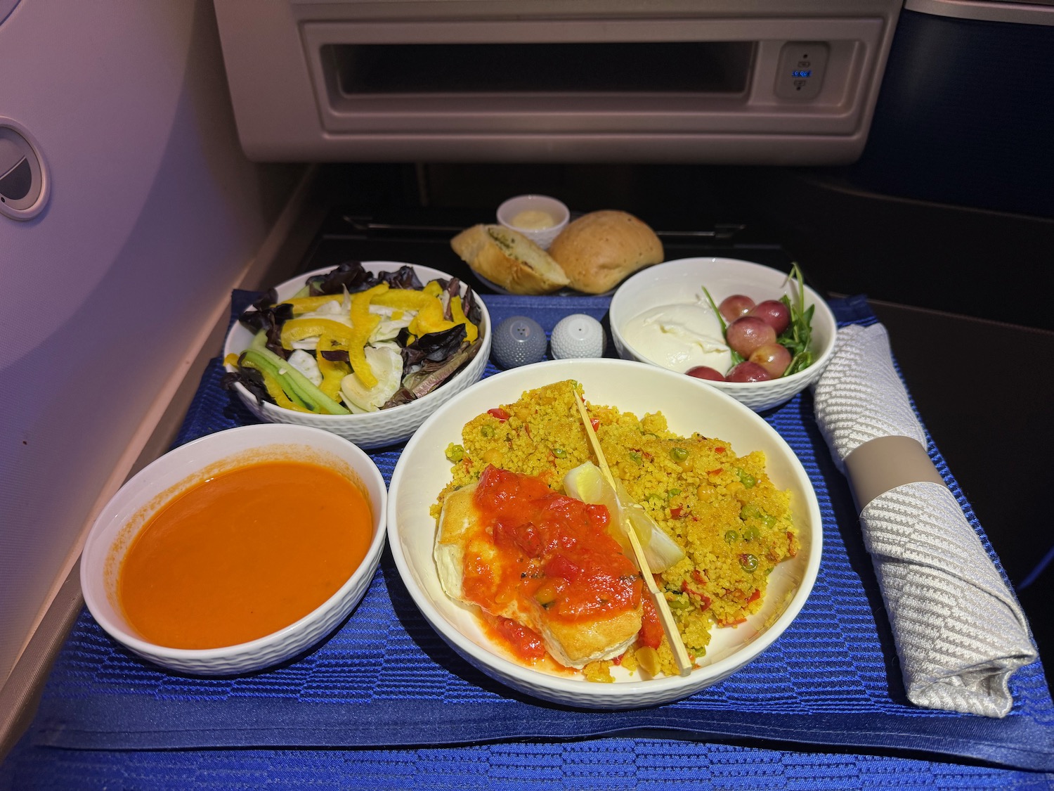 a plate of food on a blue place mat