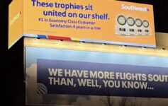 a large billboard with a blue and white sign