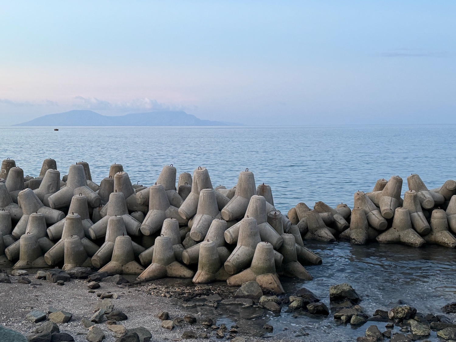 a group of concrete blocks on a beach