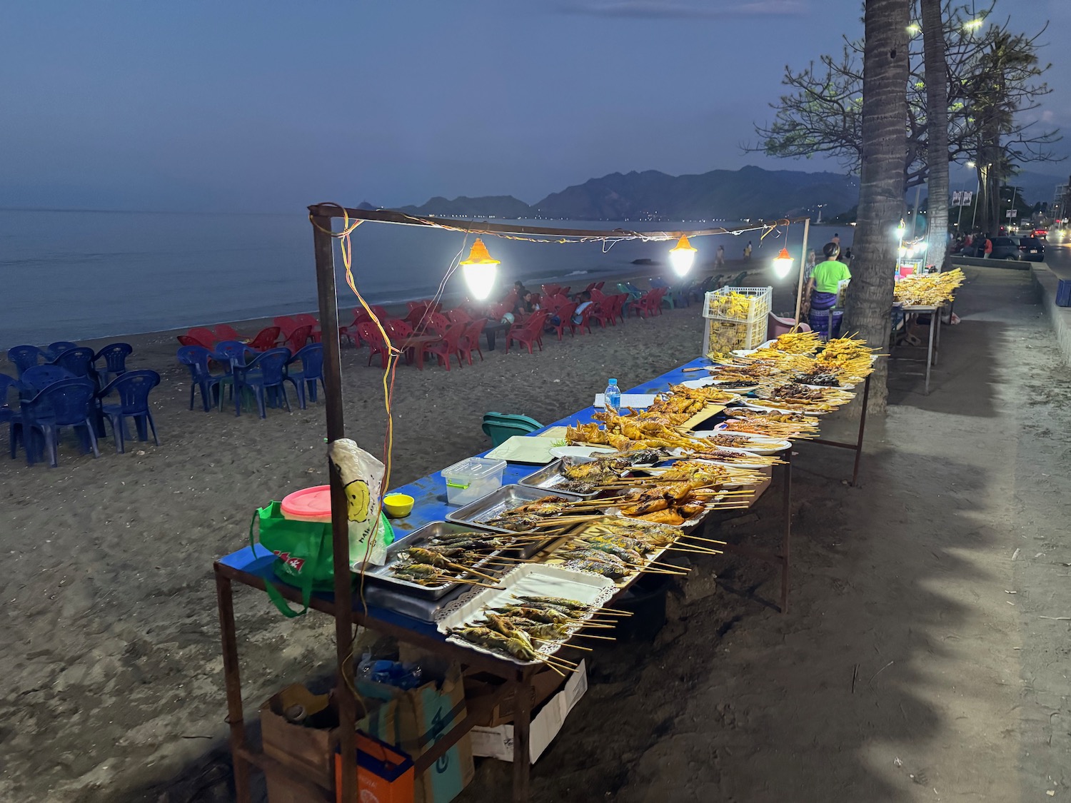 a table with food on it at a beach