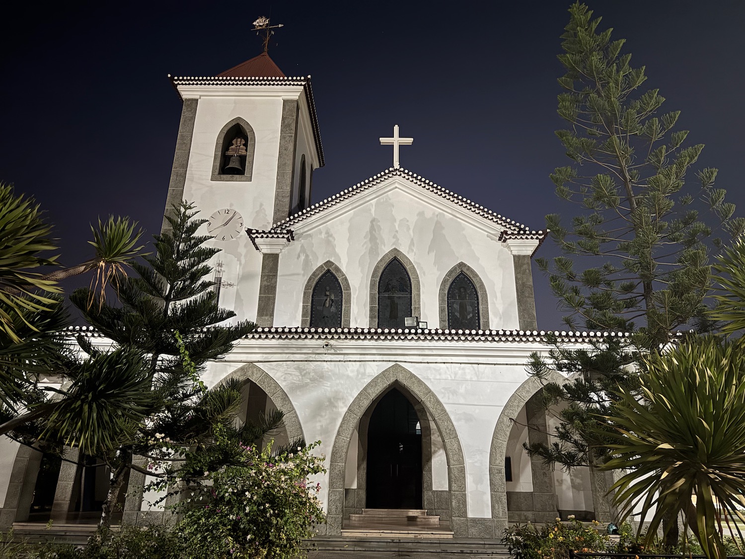 a white church with a cross on top