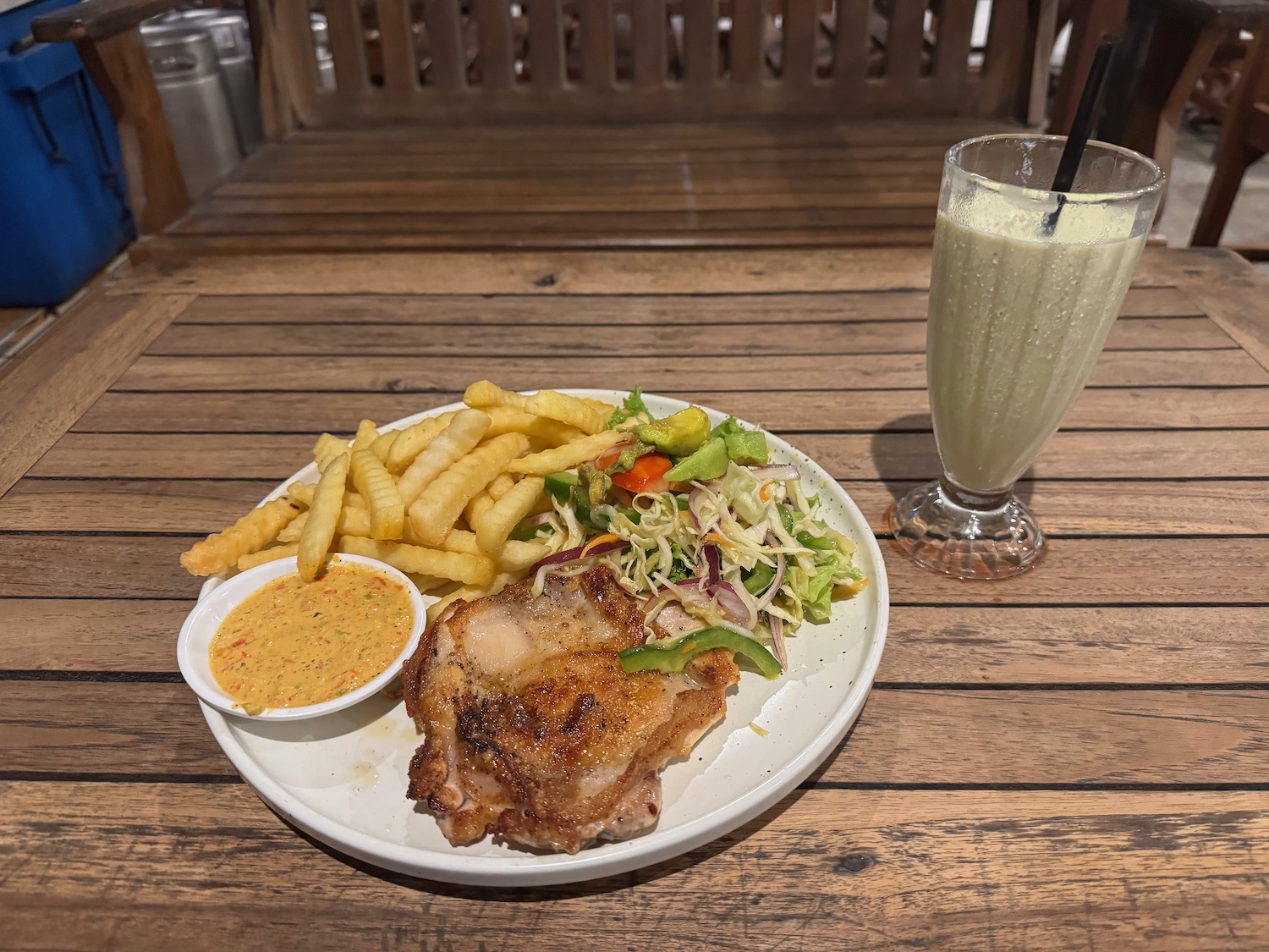 a plate of food and a drink on a table