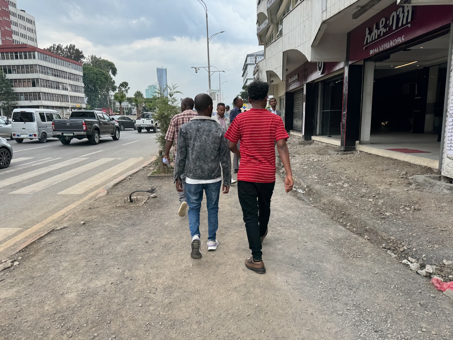 a group of people walking down a street