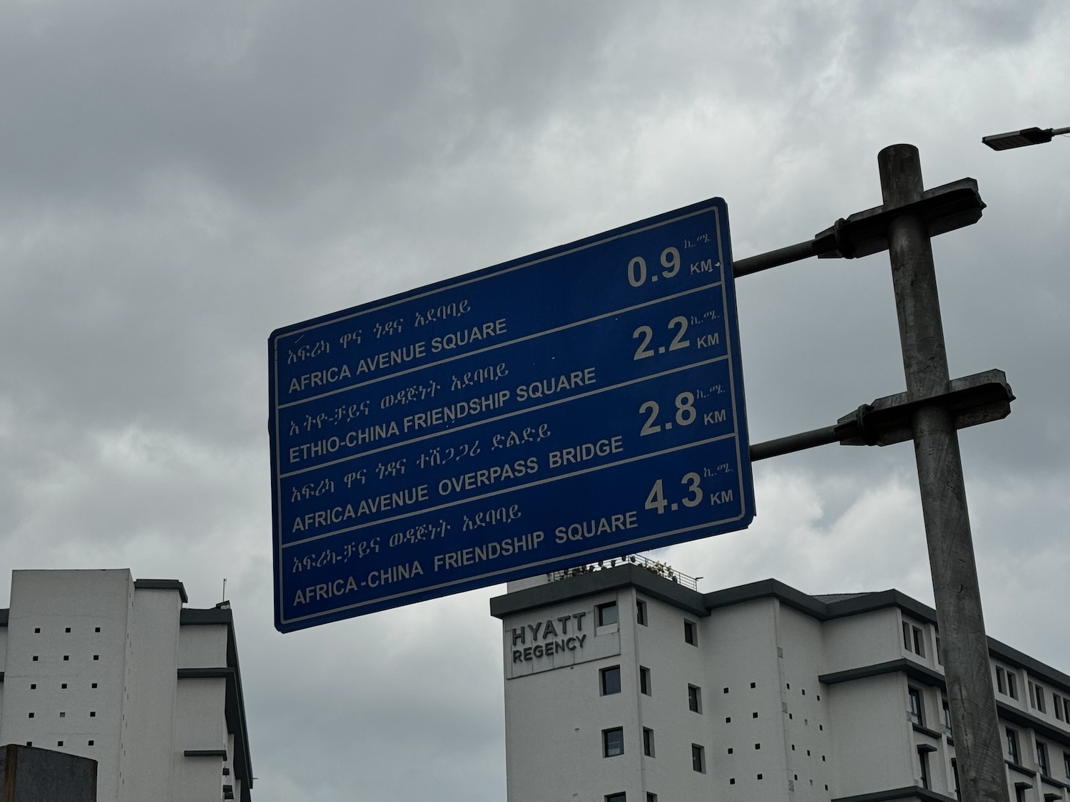 a blue sign with white text on it