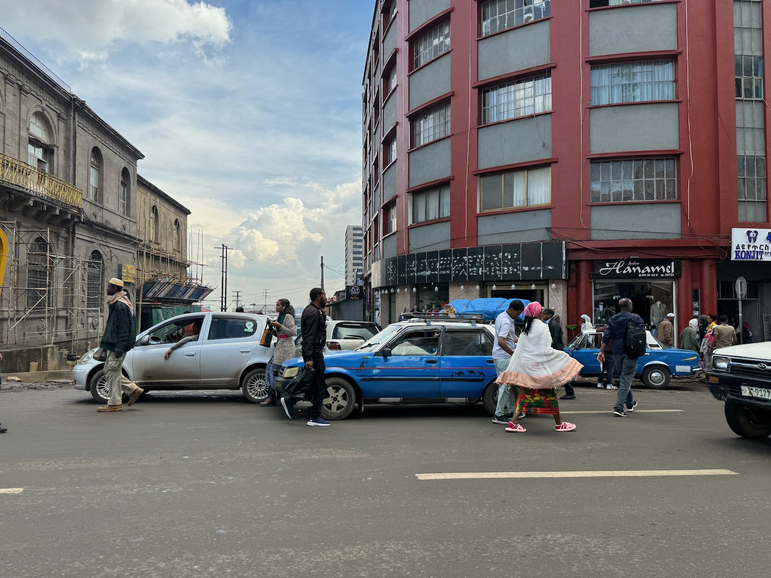 a group of people walking in a street