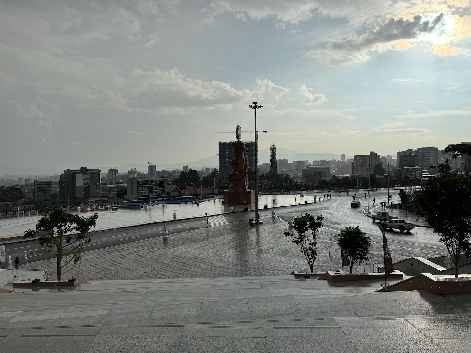 a city with a large statue and a river