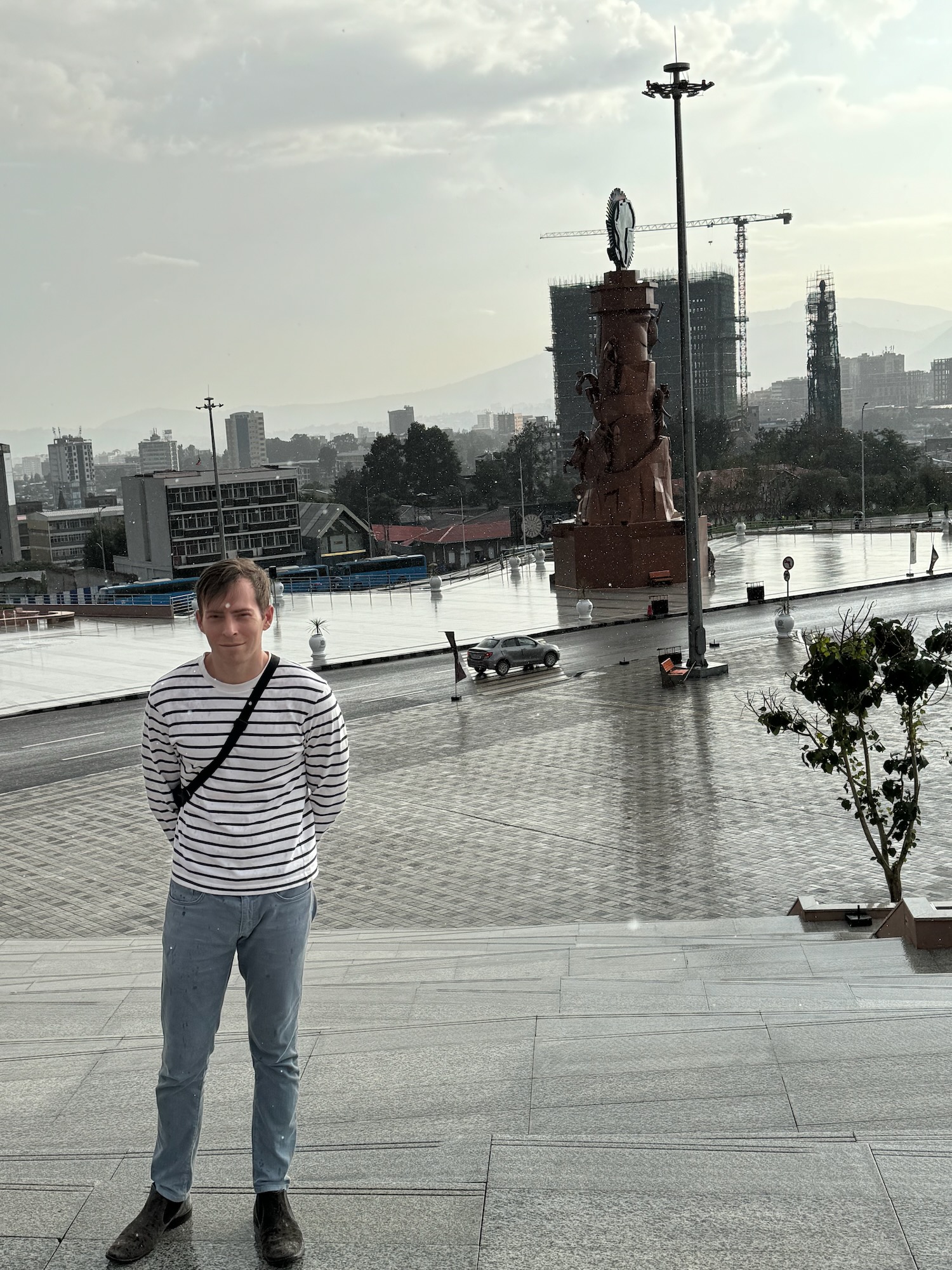 a man standing on a stone staircase