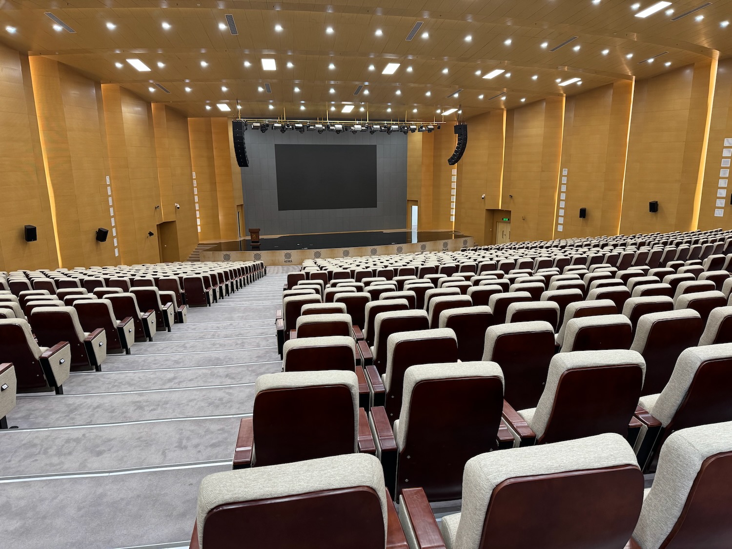 a large auditorium with a screen