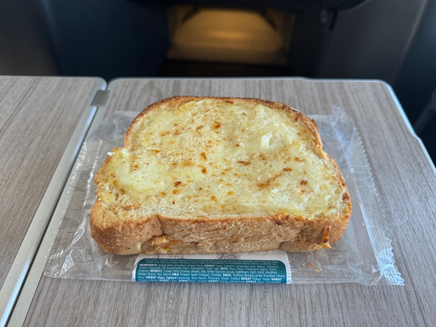 a piece of toast with cheese on it