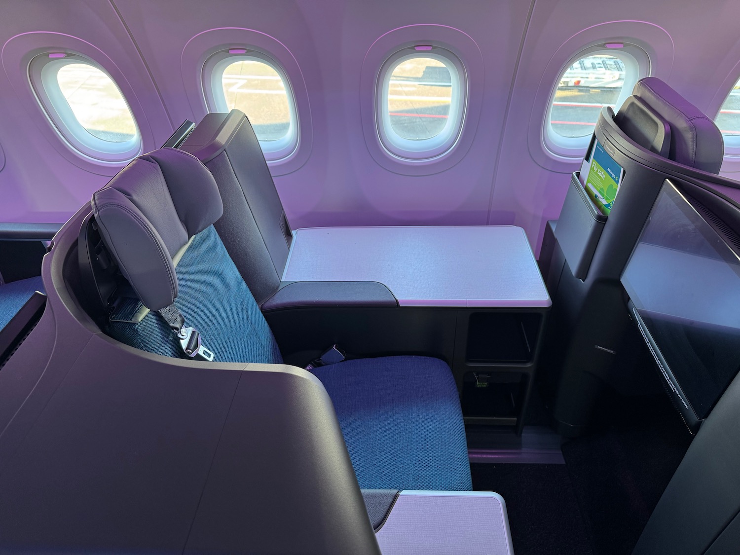 a seat and window in an airplane