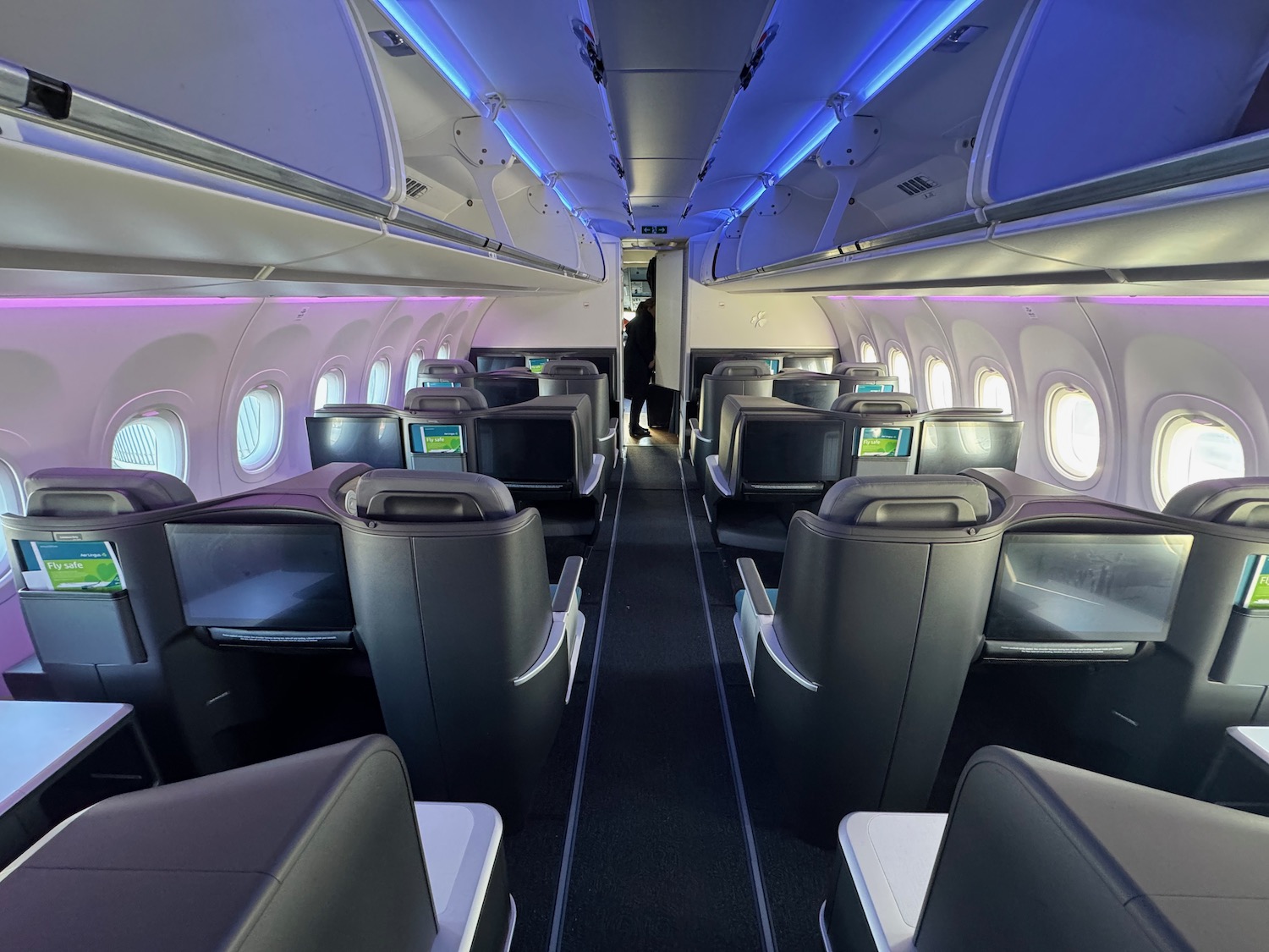 inside an airplane with rows of seats