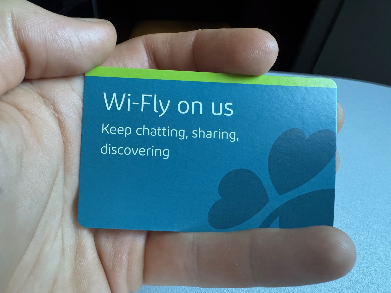 a hand holding a card